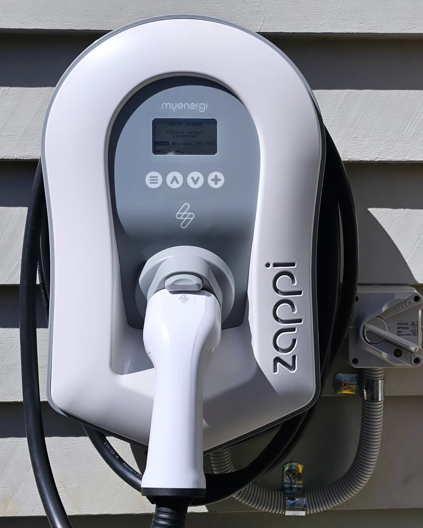 Zappi myenergi charger on outdoor weatherboard — Brisbane