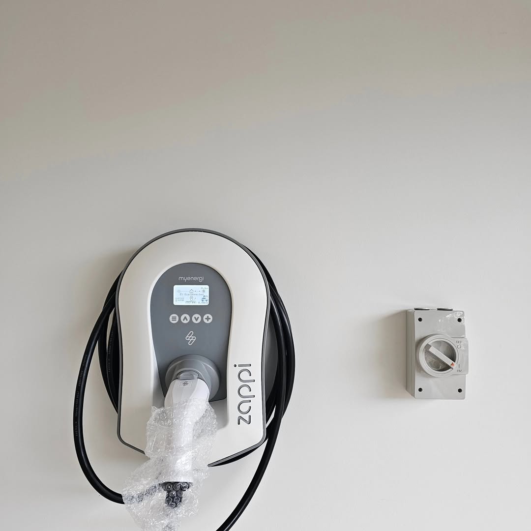 Zappi myenergi EV charger with coiled cable and isolator