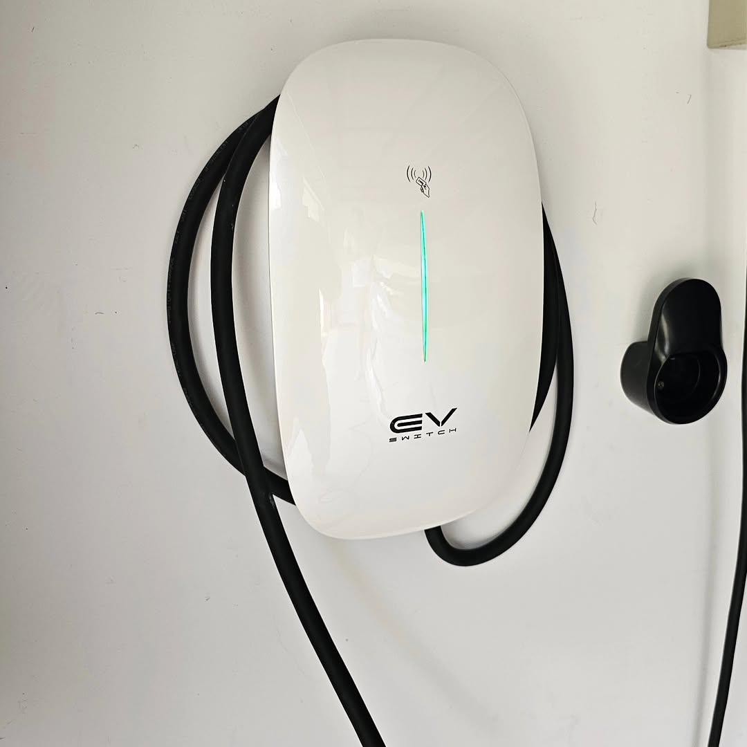 EV Switch charger — white, wall-mounted with charging cable