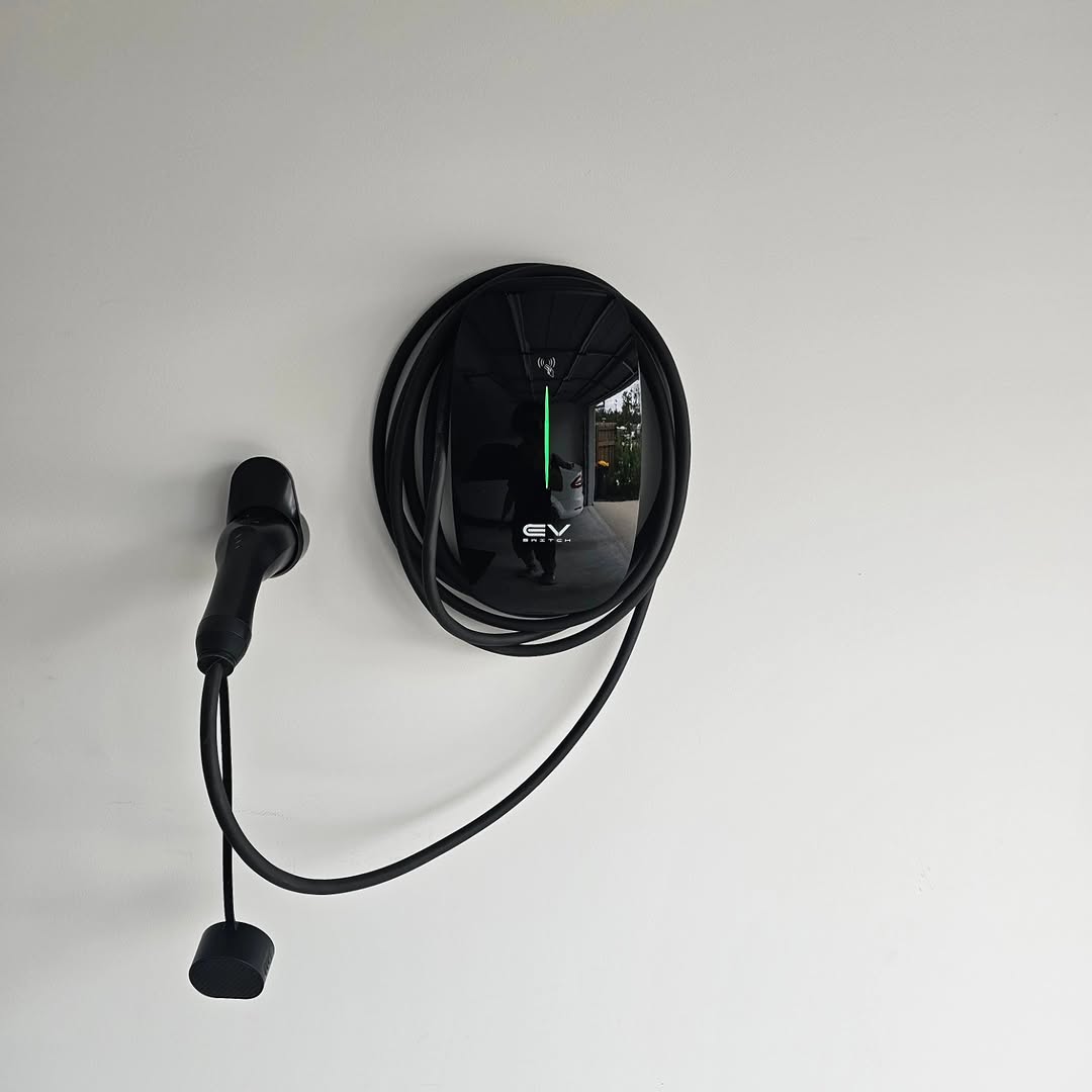 EV Switch black round charger — residential installation