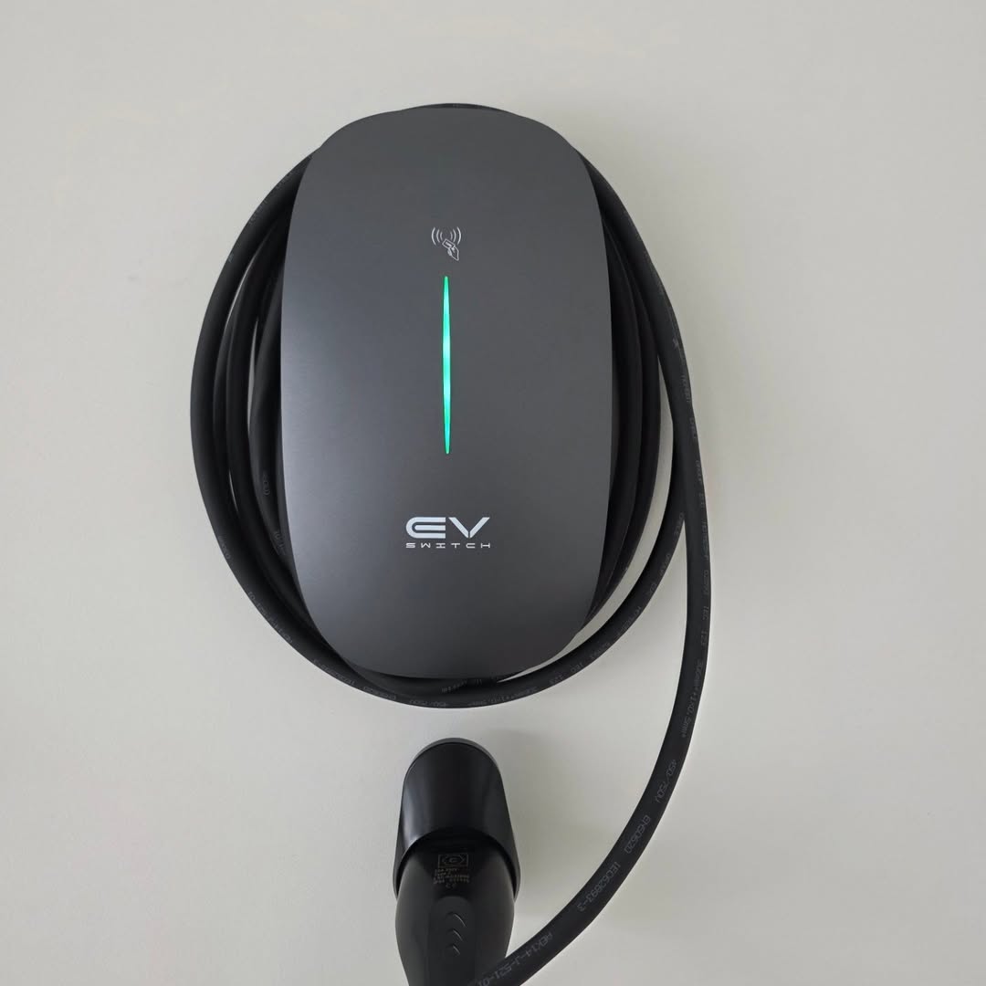 EV Switch charger — dark grey wall mount installation